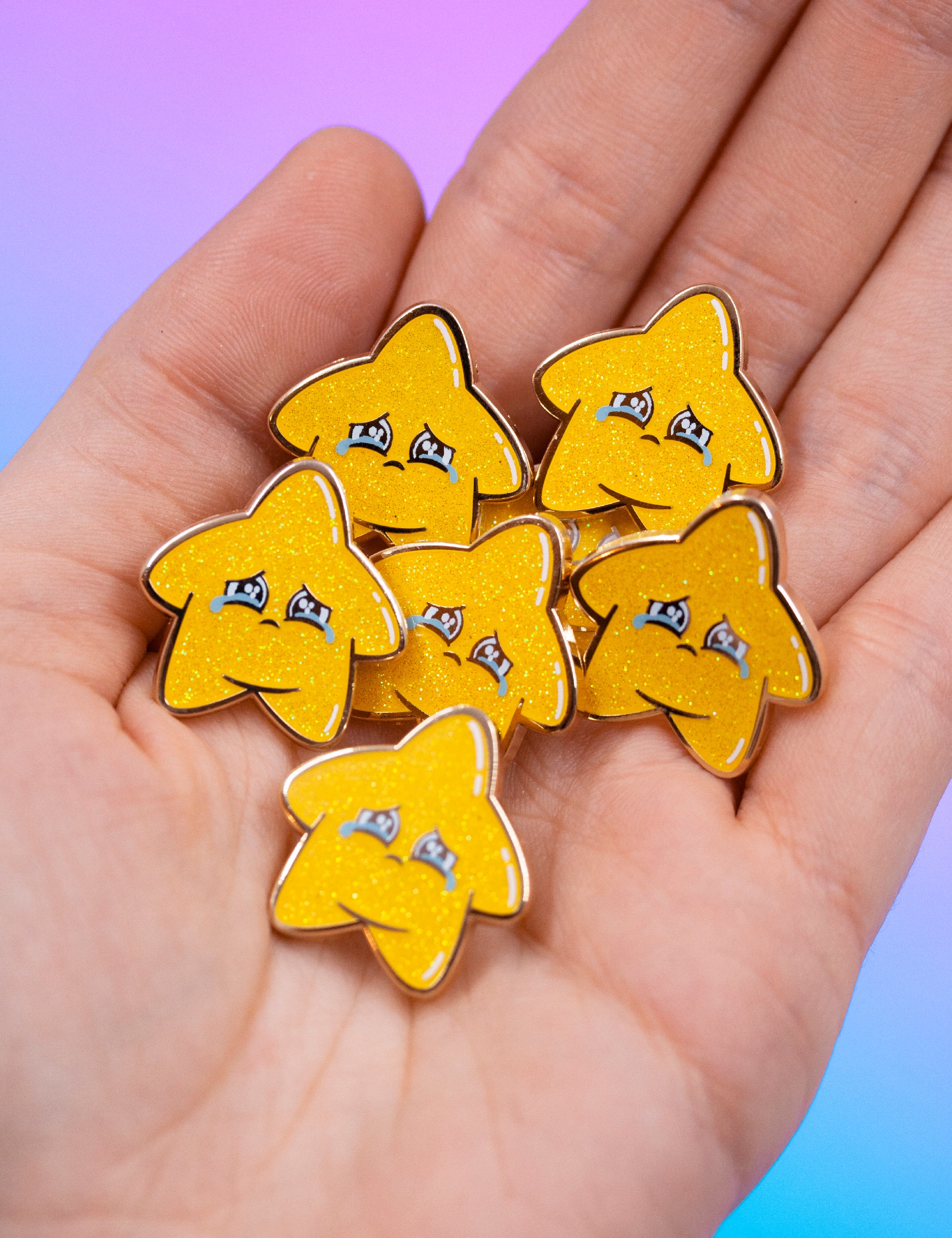 PIN&#39;S ÉTOILE À PAILLETTES TRISTE